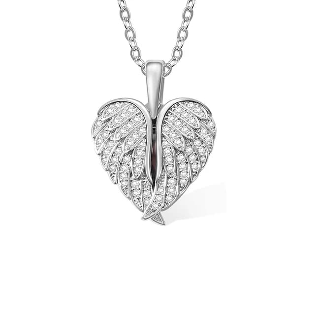 A silver heart locket framed by angel wings.