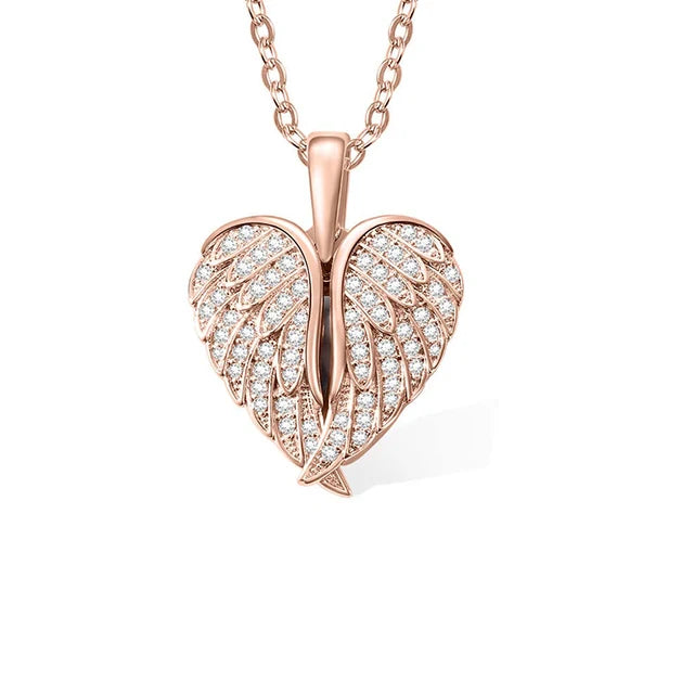 Rose gold leaf-shaped pendant with diamond accents on a white background